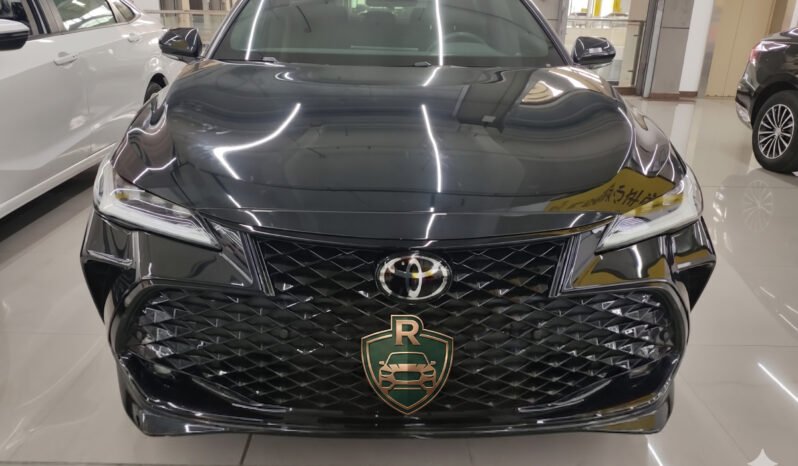 Direct front view of the 2024 Toyota Avalon 2.0L Progress Edition showing the symmetrical grille and Toyota emblem.