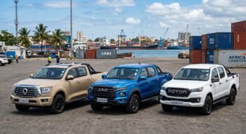 A promotional image featuring three top-tier Chinese pickup trucks curated by RICHING AUTO, parked at a bustling African shipping port. The lineup includes a tan GWM Poer, a metallic blue JAC Hunter, and a white Foton Tunland, all displayed with "RICHING AUTO" branding on their license plates. The background showcases a professional logistics environment with cargo ships, industrial cranes, and blue shipping containers labeled "AFRICA LOGISTICS," emphasizing a robust import and supply chain presence.
