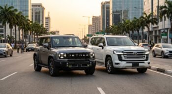 Jetour T2 and Toyota Land Cruiser SUVs parked on a modern street in Lagos, Nigeria.