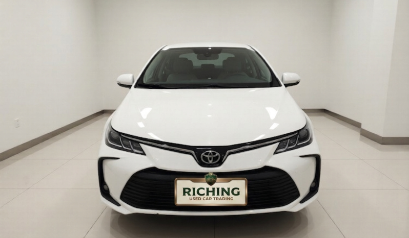 Front view of a white 2022 Toyota Corolla 1.2T Pioneer PLUS sedan with Turbo engine.