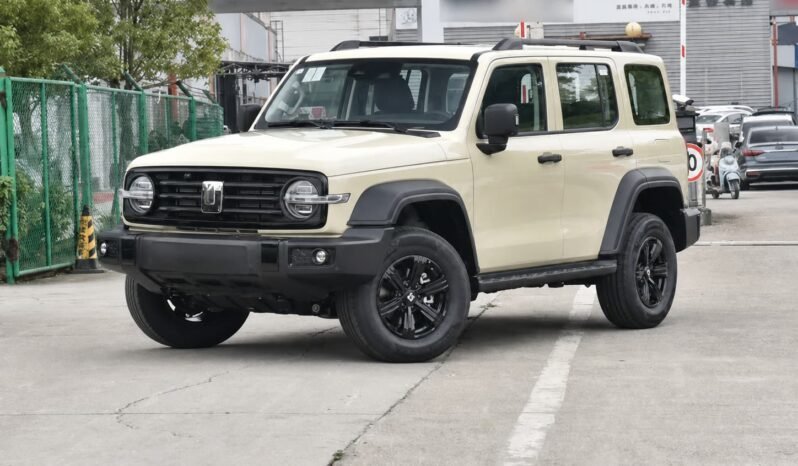 Front three-quarter view of Beijing 212 T01 beige off-road SUV showing boxy body design, round headlights, black grille, roof rails and rugged exterior styling