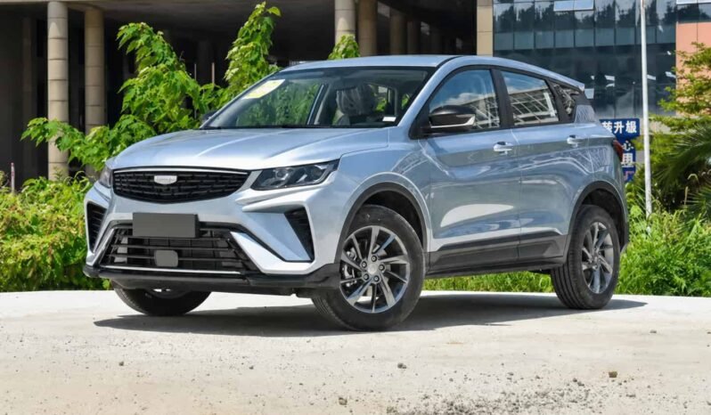 Front three-quarter view of Geely Coolray silver SUV showing front grille, headlights, alloy wheels, side profile and outdoor display