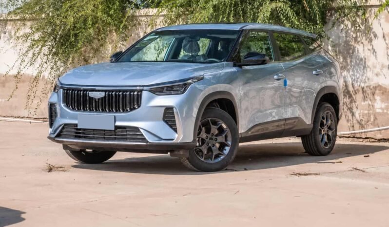 Rear three-quarter view of Geely Boyue 2026 1.5TD light blue SUV showing taillights, rear spoiler, tailgate design, alloy wheels and SUV body profile