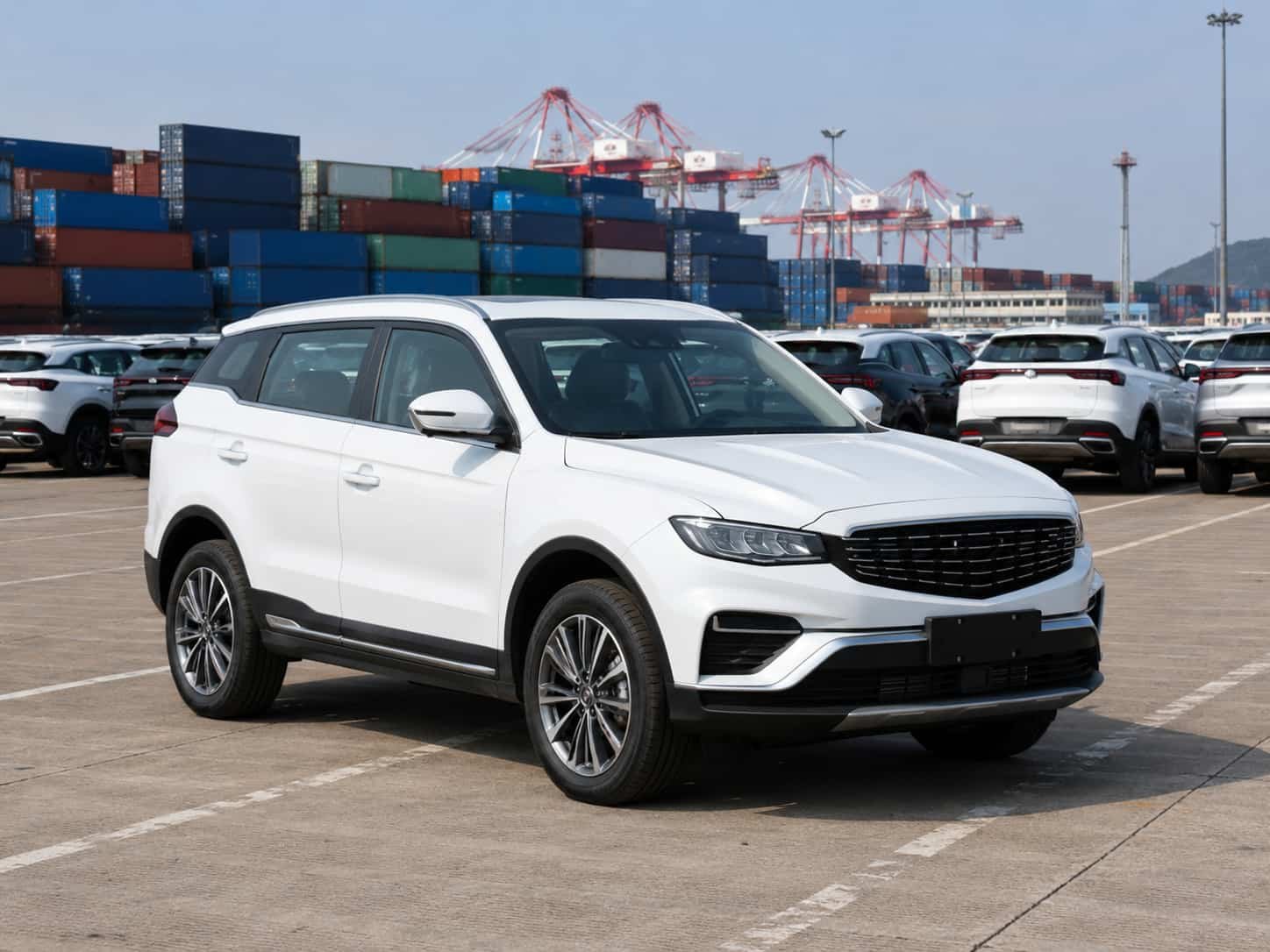 Geely Boyue Pro mid-size SUV parked at a Guangzhou vehicle export yard ready for container loading to Africa and Middle East
