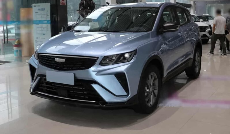 Front three-quarter view of Geely Coolray light blue SUV showing front grille, headlights, alloy wheels, side profile and showroom display