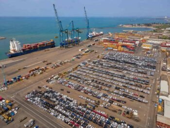 Chinese SUVs and sedans being unloaded at Tema Port Ghana for import by local car dealers in Accra