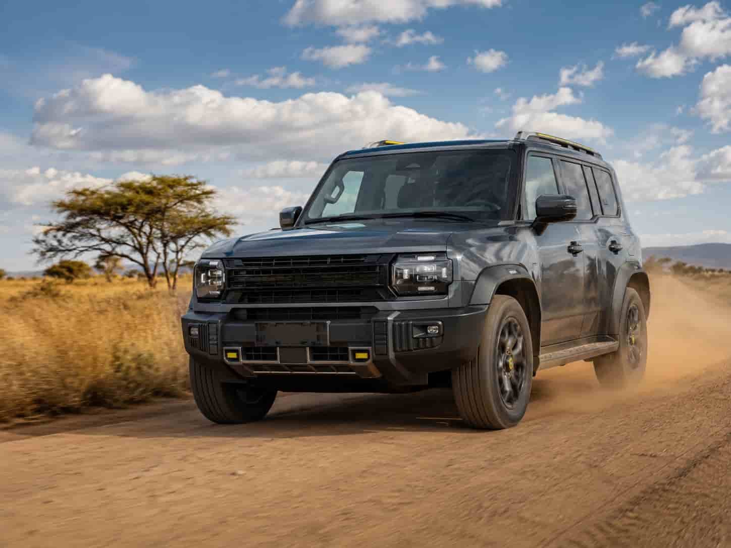 Jetour T2 full-size body-on-frame SUV driving on a dusty African road suitable for export to Nigeria Kenya and East Africa dealers