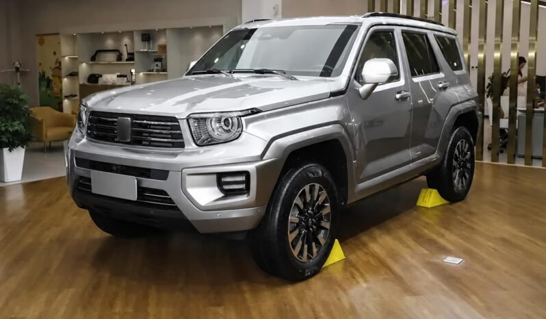 Front three-quarter view of TANK 300 2025 silver off-road SUV showing round headlights, front grille, rugged bumper, alloy wheels and boxy body design