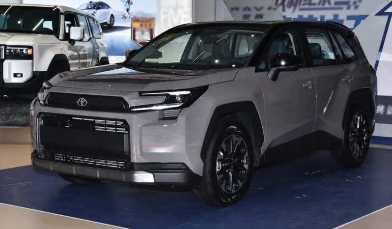Front three-quarter view of Toyota RAV4 2026 2.0L 2WD Luxury SUV showing the front grille, headlights, side profile and grey body color