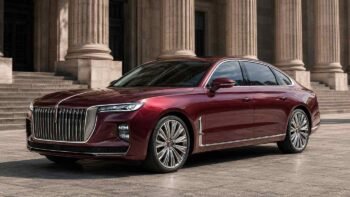 Hongqi H9 luxury sedan in deep red colour parked in front of a grand building representing Chinese premium automotive export for overseas dealers