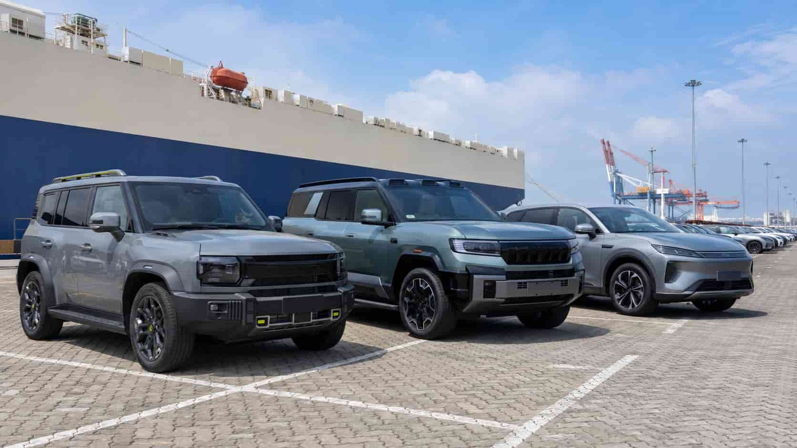 New Jetour T2 and Fang Cheng Bao 8 vehicles at a Guangzhou export yard showing growing demand from new energy brands