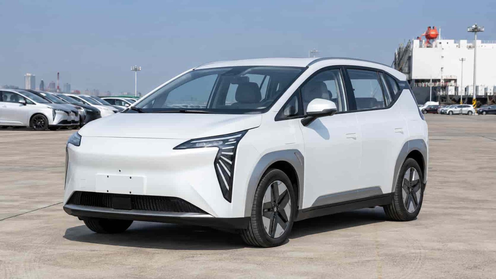 AION Y Plus electric SUV at a Guangzhou export yard positioned as an alternative to BYD Dolphin for RHD market dealers